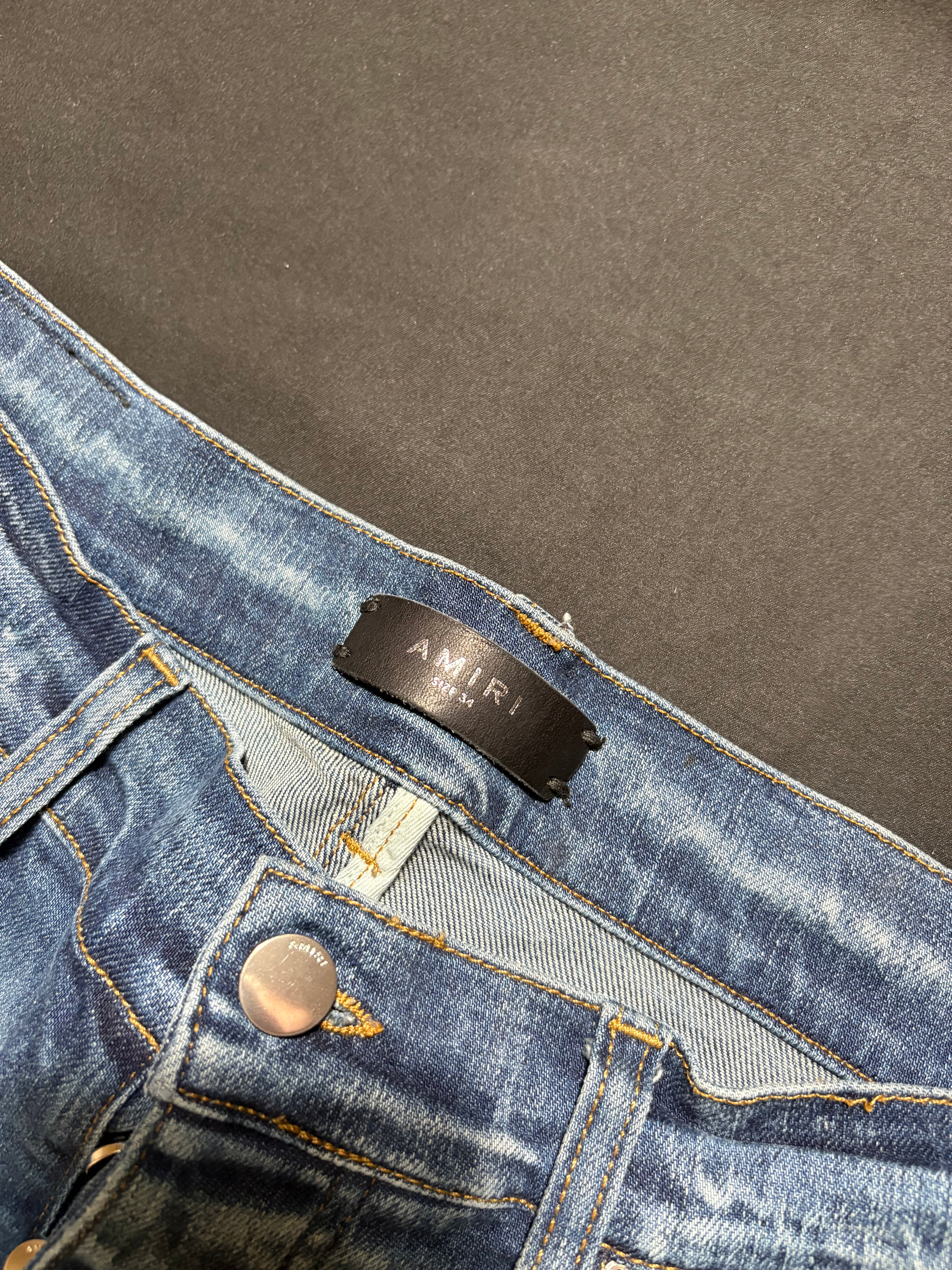 Amiri MX1 LightWash Black Patch Jeans