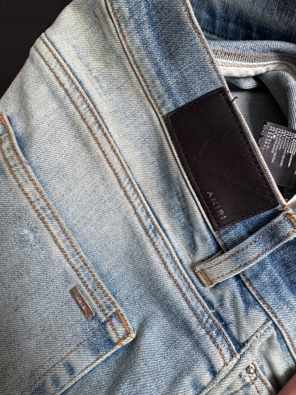 Amiri MX1 Light Wash Black Patch Jeans