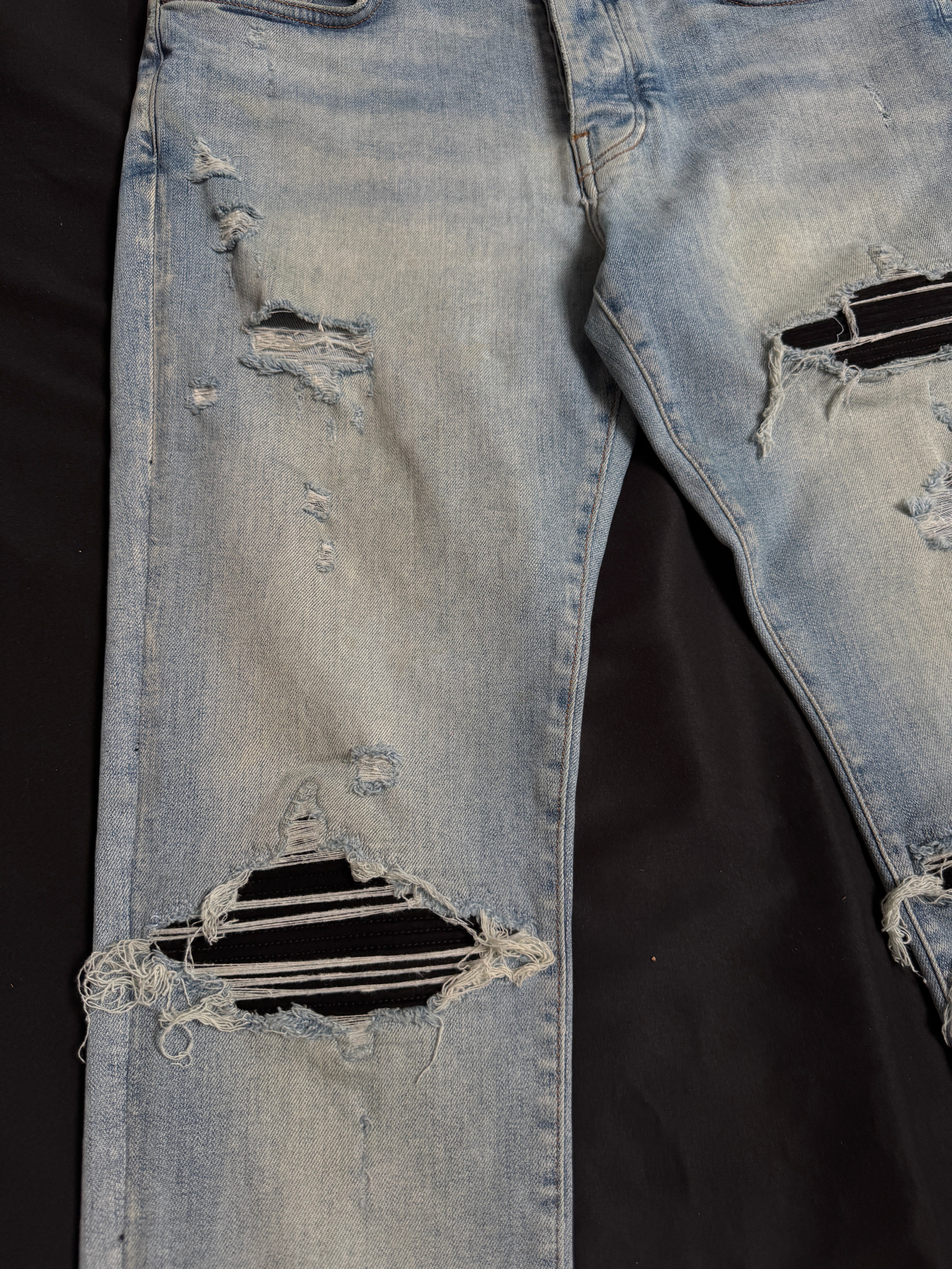 Amiri MX1 Light Wash Black Patch Jeans