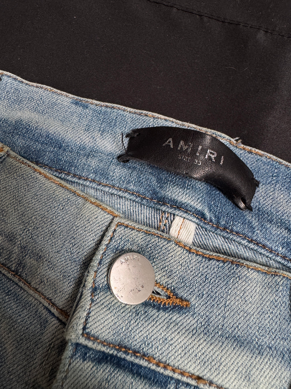 Amiri MX1 Light Wash Black Patch Jeans