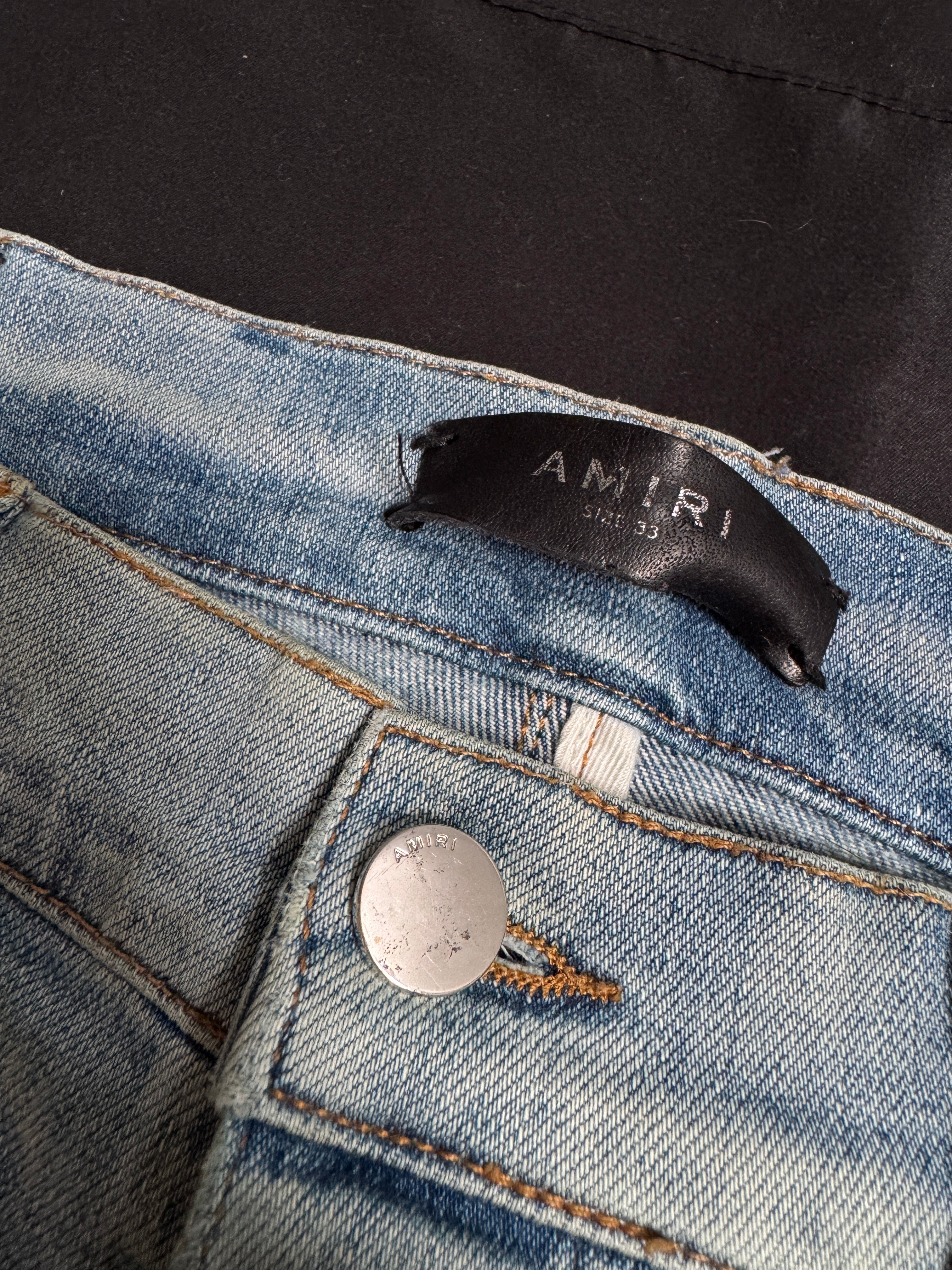 Amiri MX1 Light Wash Black Patch Jeans