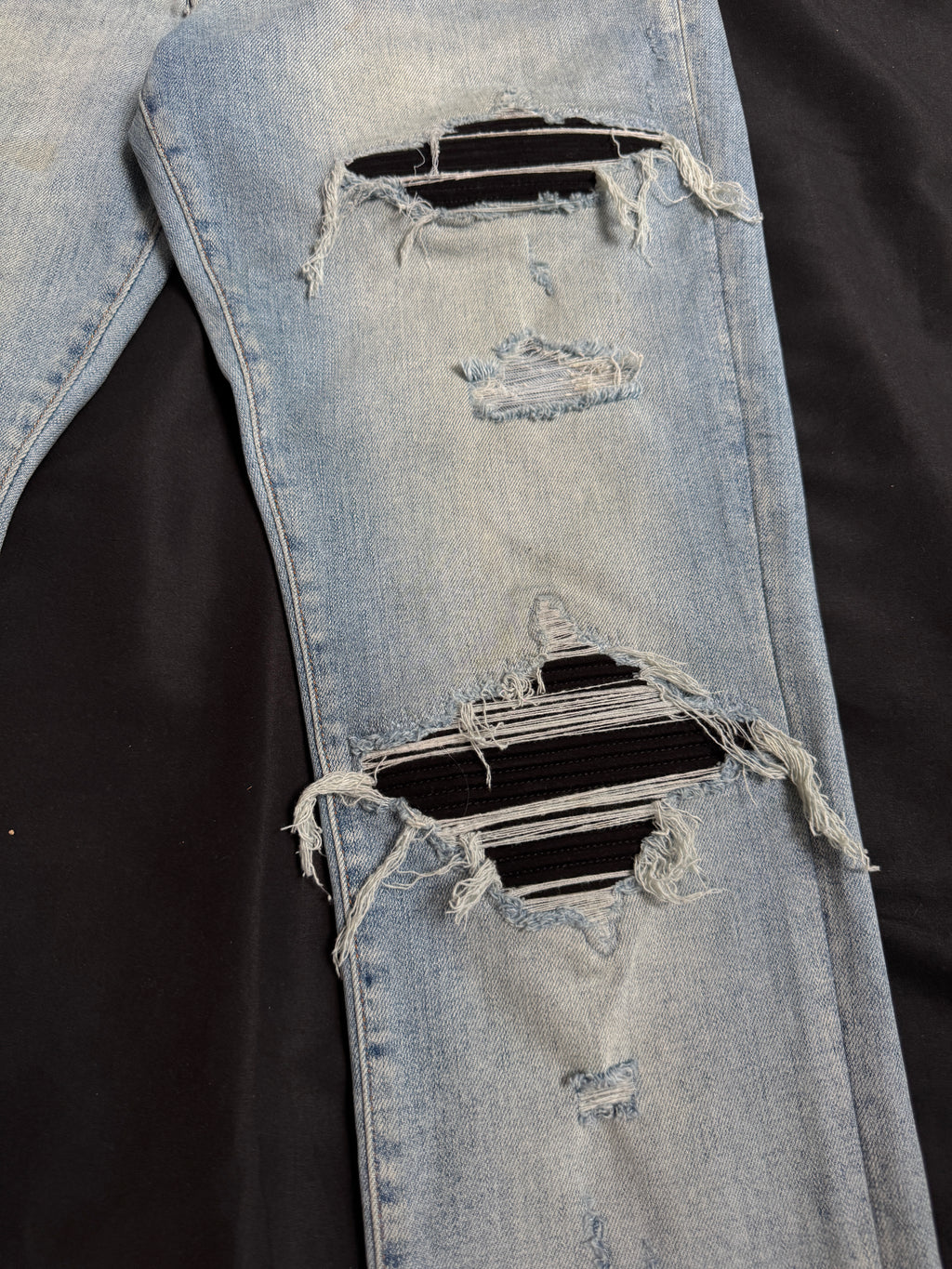 Amiri MX1 Light Wash Black Patch Jeans