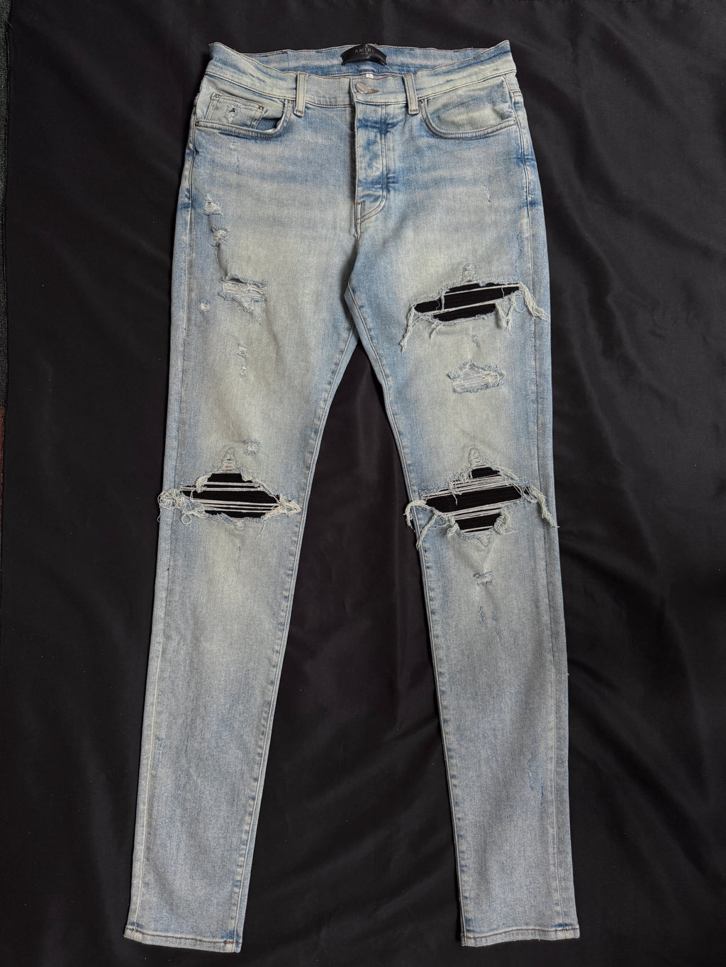 Amiri MX1 Light Wash Black Patch Jeans